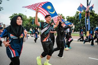 ‘Fly It Proudly’: Fahmi Urges Malaysians to Display Jalur Gemilang for Unity and Patriotism