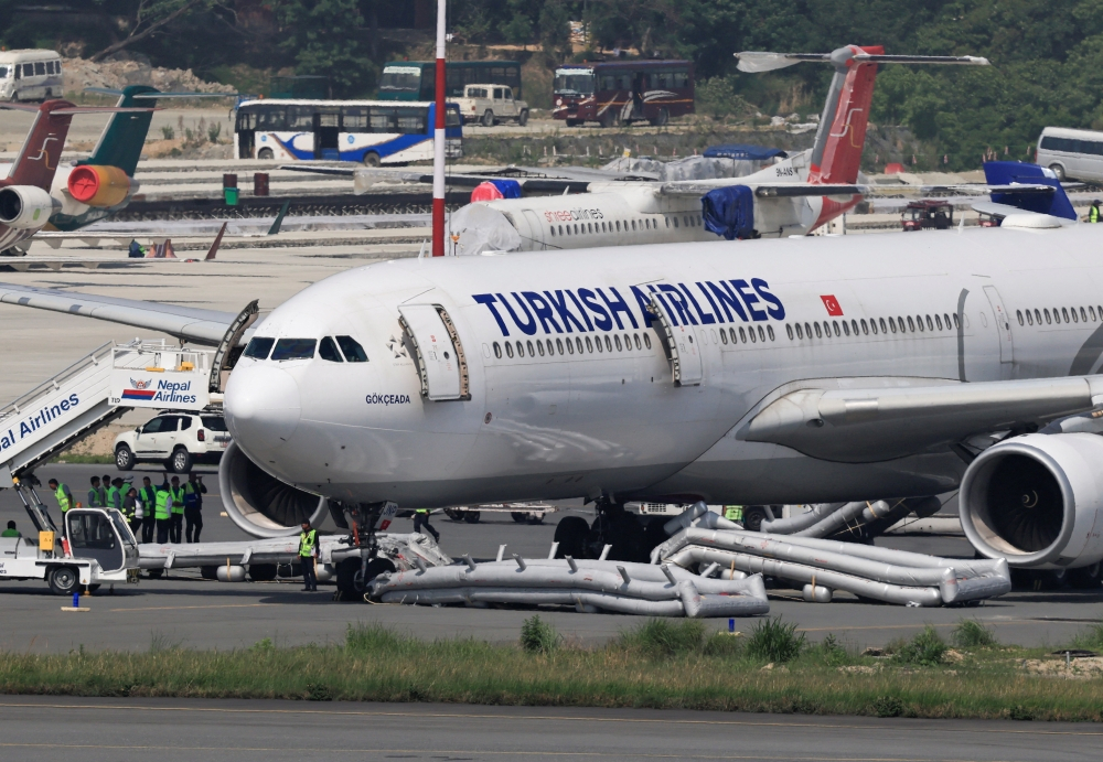 Turkish Airlines flight safely evacuated after landing gear fire briefly shuts Kathmandu airport