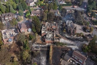 UK firefighters battle raging wildfires as heatwave scorches homes and puts thousands at risk